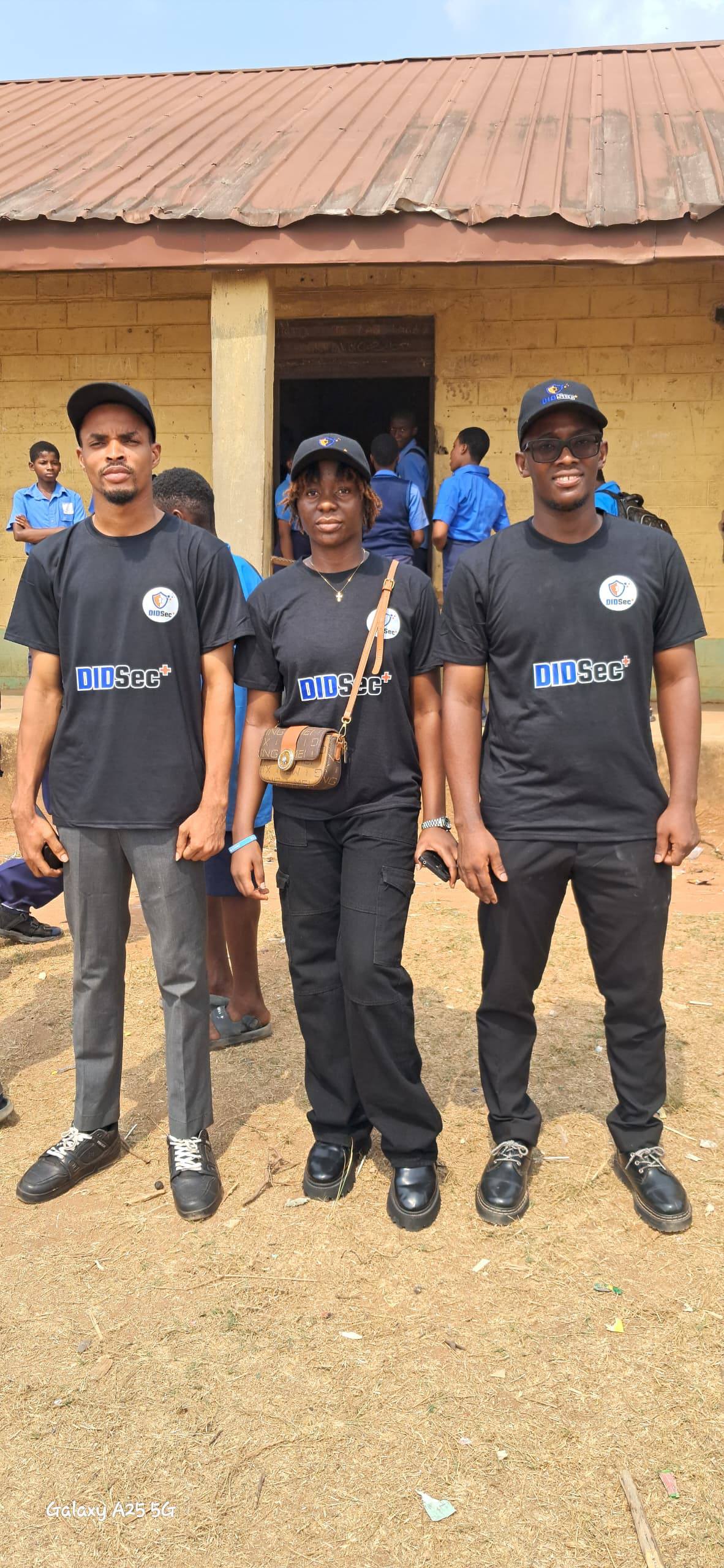 DIDSec+ team in branded shirts outside Ibeku High School